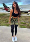 Model facing forward wearing our reversible tank bra in camo and a matching leggings 