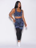 Front profile view of a model in our scrunch thigh high in blue leopard print and a matching bra 