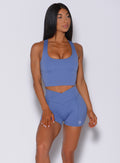 Front profile view of a model in our ultimate tank bra in denim blue color and a matching  shorts 